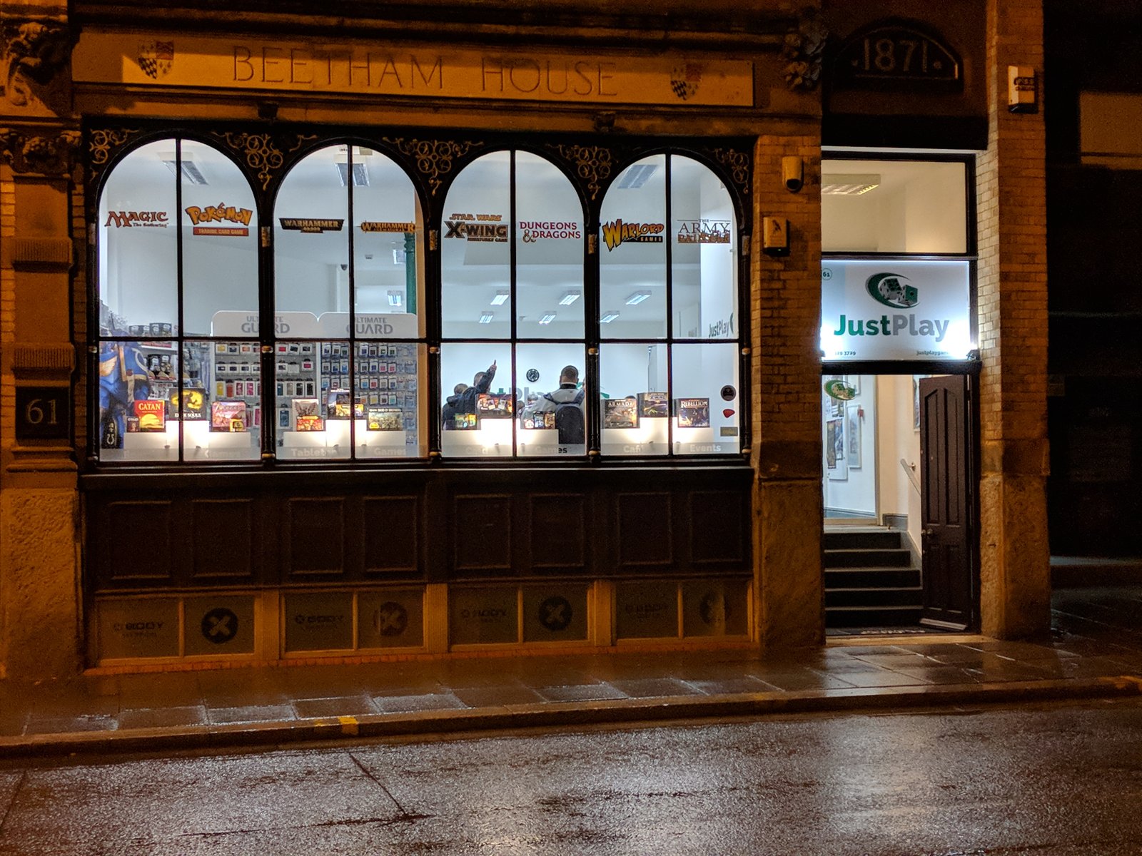 JustPlay storefront at night